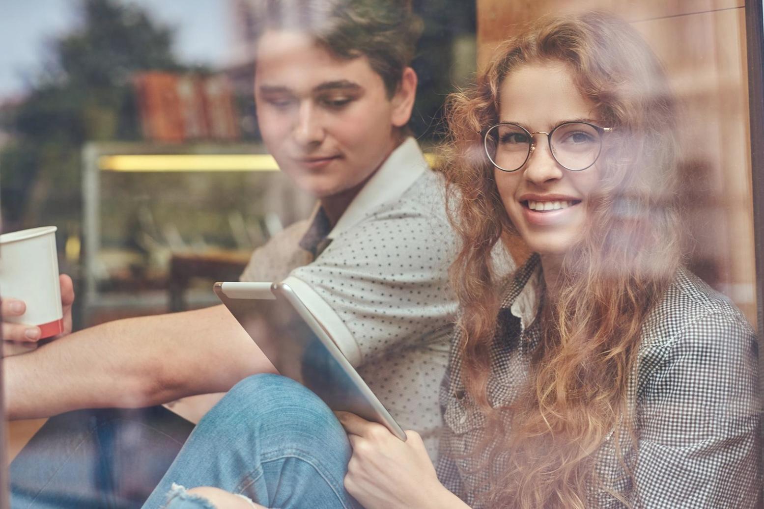 Modern office workspace with financial documents and presentation materials spread on desk